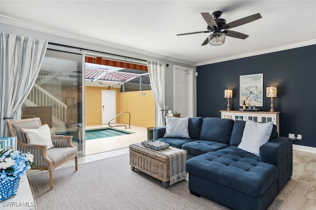 living room featuring ceiling fan and crown molding