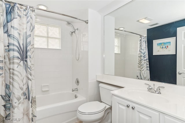 full bathroom featuring vanity, toilet, and shower / bath combo