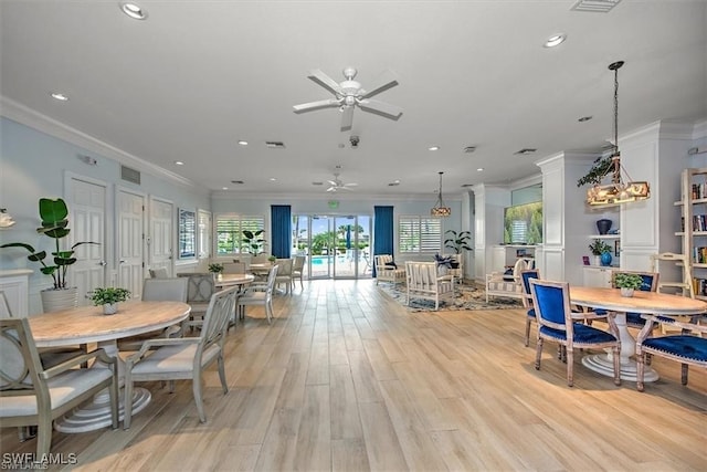 dining area featuring ceiling fan, light hardwood / wood-style flooring, and ornamental molding