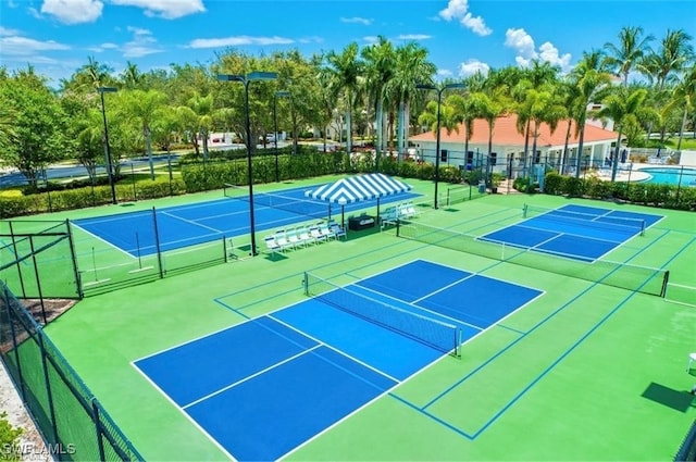 view of sport court with basketball hoop