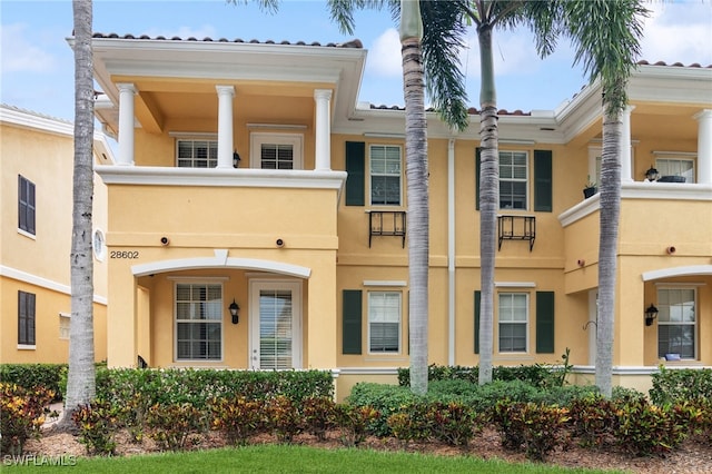 view of front of property with a balcony