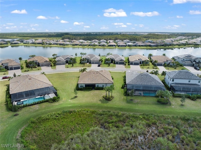 birds eye view of property featuring a water view