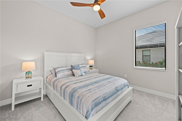 bedroom with light colored carpet and ceiling fan