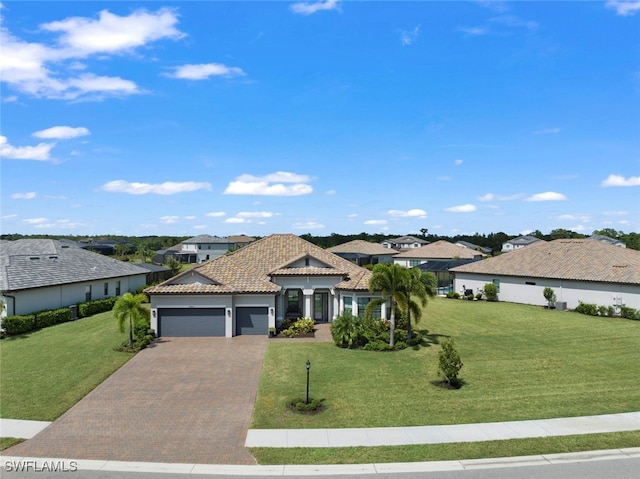 view of front facade with a front yard and a garage