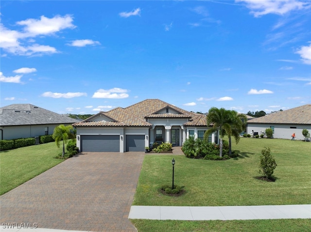 view of front of property featuring a front lawn and a garage