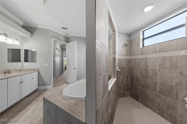 bathroom featuring vanity, ornamental molding, shower with separate bathtub, and hardwood / wood-style floors