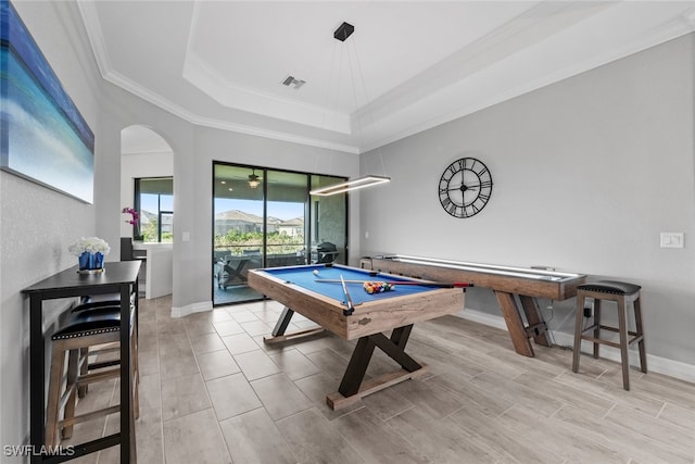 rec room with light hardwood / wood-style floors, crown molding, billiards, and a raised ceiling