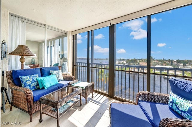 sunroom with a water view