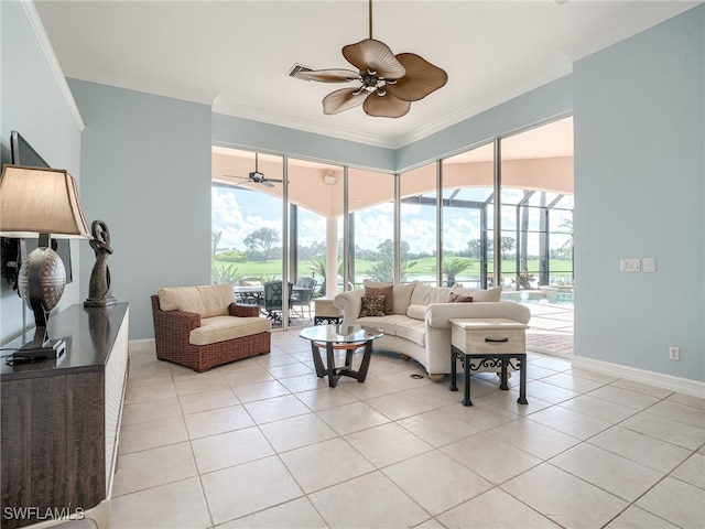 living room with crown molding, light tile patterned flooring, ceiling fan, and plenty of natural light