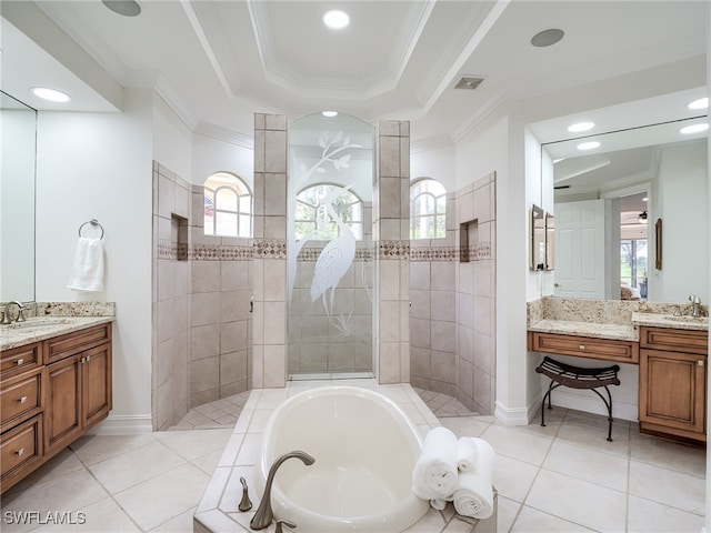 bathroom with plus walk in shower, ornamental molding, plenty of natural light, and vanity