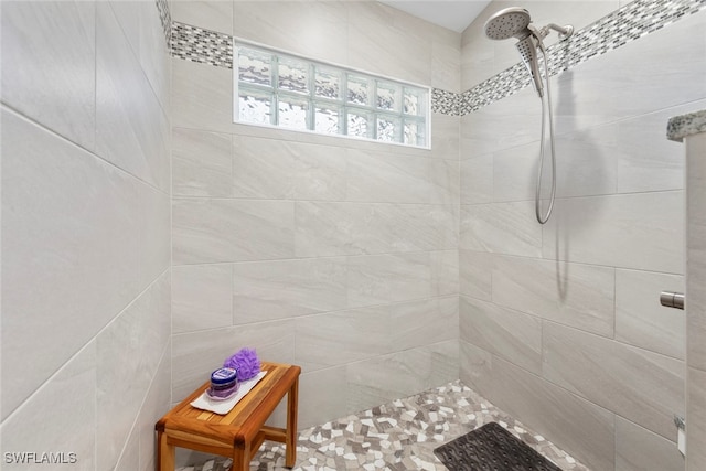 bathroom with tiled shower