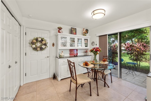 dining area featuring light tile patterned floors