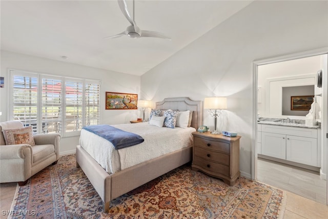 bedroom with sink, lofted ceiling, ensuite bathroom, light tile patterned floors, and ceiling fan