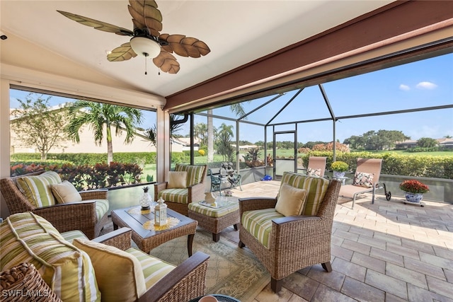 view of patio featuring a lanai, ceiling fan, and outdoor lounge area