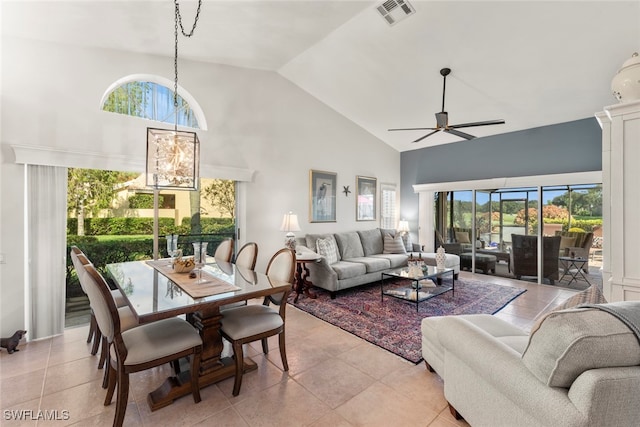 living room featuring ceiling fan, light tile patterned floors, and high vaulted ceiling