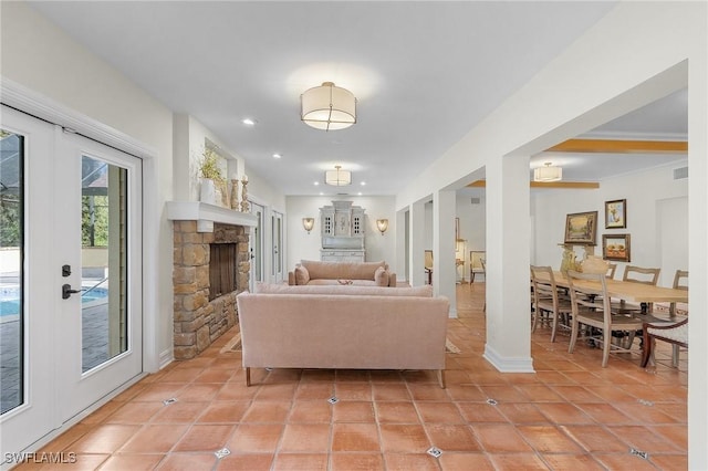 3628 Heritage Ln, Fort Myers, FL 33908 - living area featuring light tile patterned floors, recessed lighting, a stone fireplace, and visible vents