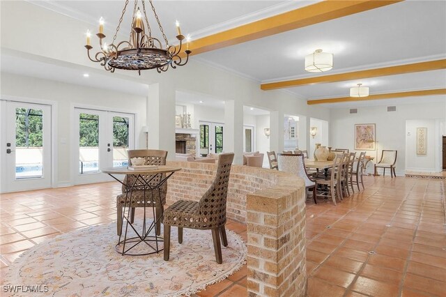 dining space with french doors, beamed ceiling, crown molding, a chandelier, and light tile patterned floors