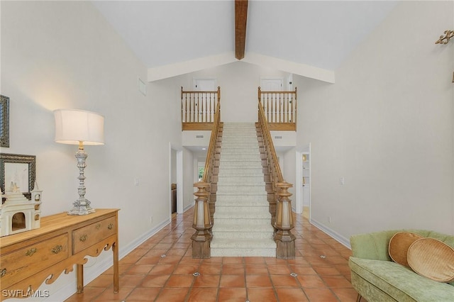 stairway with tile patterned flooring, baseboards, high vaulted ceiling, and beam ceiling