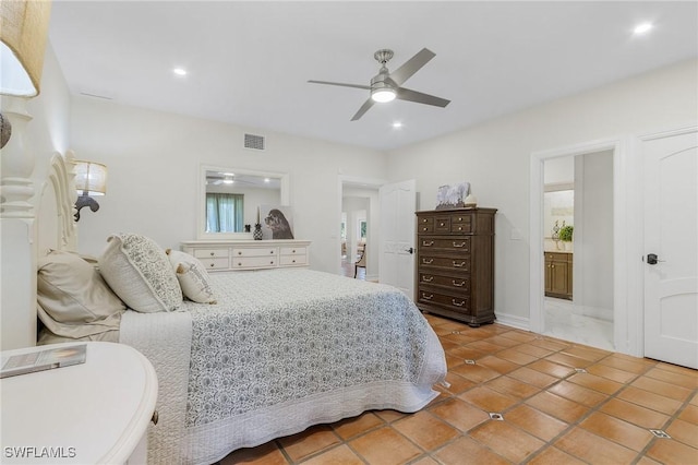 bedroom with connected bathroom, ceiling fan, and light tile patterned floors