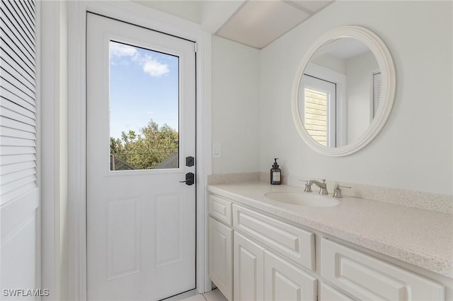 bathroom featuring plenty of natural light and vanity