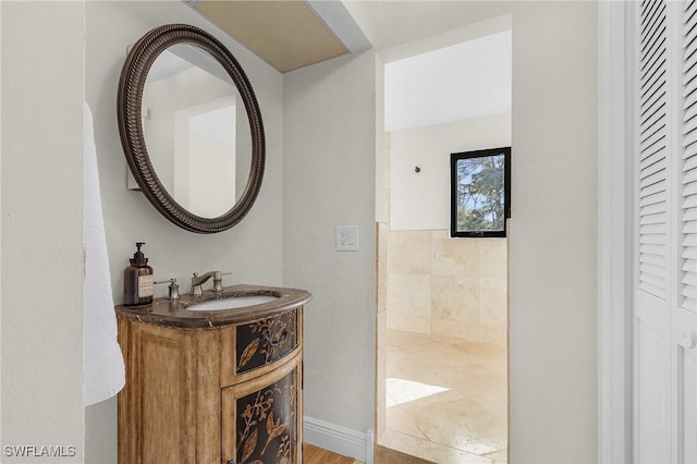 bathroom featuring a closet and vanity