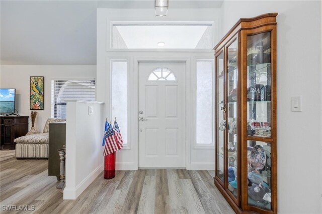 foyer entrance with light wood-type flooring