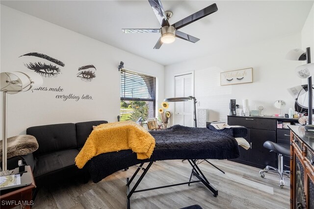 bedroom featuring ceiling fan and light hardwood / wood-style floors