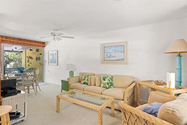 living room featuring light carpet and ceiling fan