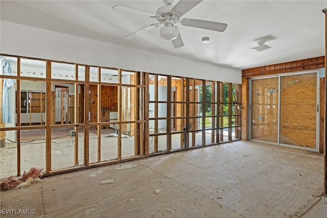 interior space with ceiling fan