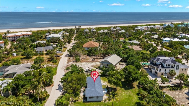 birds eye view of property featuring a view of the beach and a water view