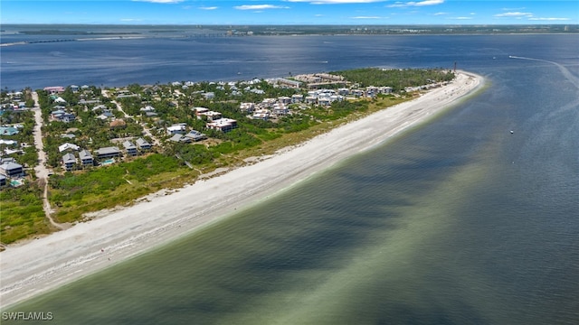 birds eye view of property featuring a water view and a view of the beach