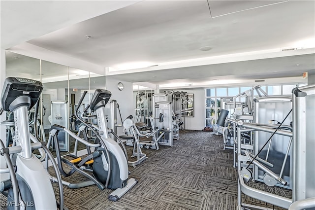 workout area featuring dark carpet