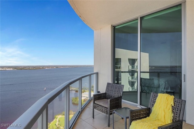 balcony featuring a water view