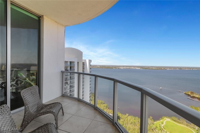 balcony featuring a water view