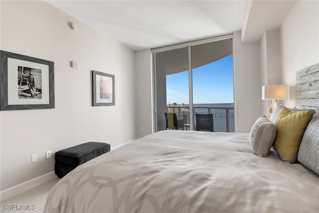 carpeted bedroom featuring access to outside