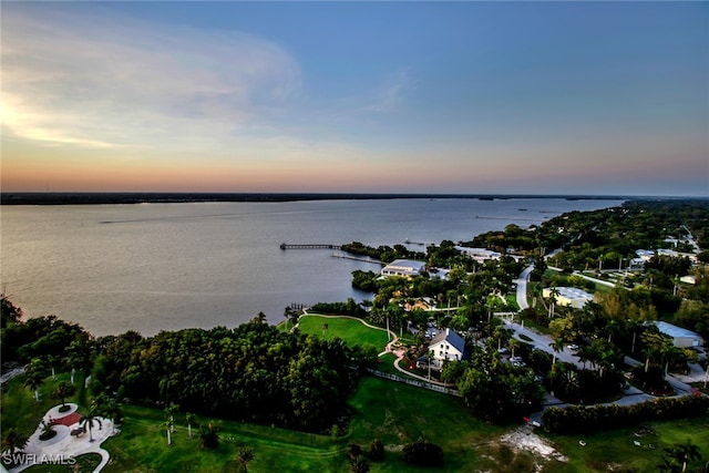 aerial view at dusk with a water view