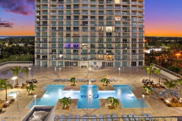 view of outdoor building at dusk