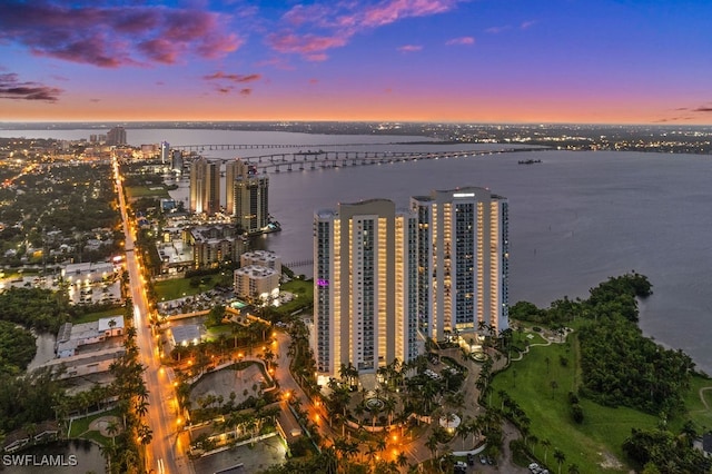 aerial view at dusk with a water view