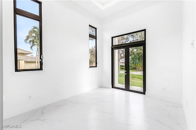 spare room featuring french doors