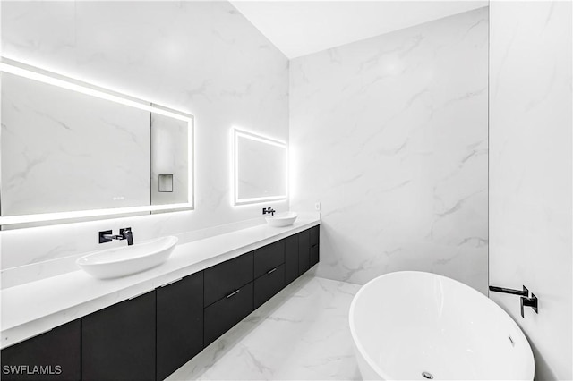 bathroom with vanity and a tub to relax in