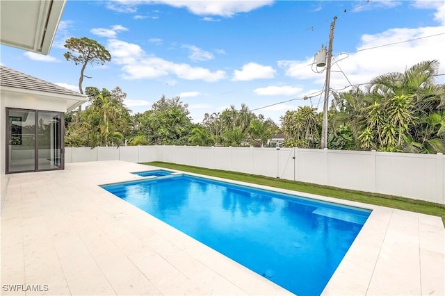 view of swimming pool featuring a patio area