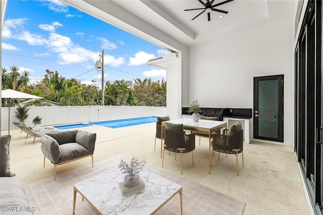 view of pool featuring ceiling fan and a patio