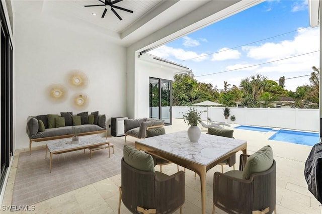 view of patio / terrace featuring a fenced in pool, outdoor lounge area, and ceiling fan