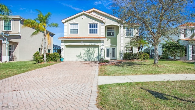 view of front of property featuring a front lawn and a garage