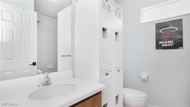 bathroom with toilet and vanity