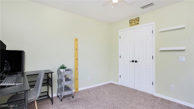 office area with carpet floors, baseboards, visible vents, and ceiling fan