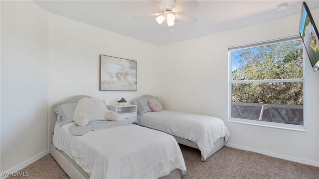 bedroom featuring carpet, ceiling fan, and baseboards