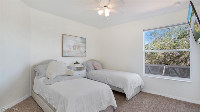2864 Blossom Ct, Naples, FL 34120 - bedroom featuring light carpet and a ceiling fan