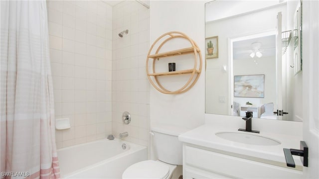 bathroom with shower / bathtub combination with curtain, toilet, a ceiling fan, vanity, and ensuite bath