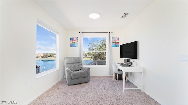 sitting room featuring carpet, visible vents, and baseboards